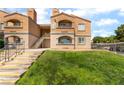Beautiful two-story apartment complex with well-maintained landscaping and visible unit numbers at 221 Mission Catalina Ln # 104, Las Vegas, NV 89107
