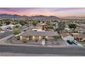 Well-maintained property with picturesque mountain views at sunset at 2251 Thoroughbred Rd, Henderson, NV 89002