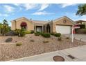 Charming single-story home featuring desert landscaping, a two-car garage, and a tile roof at 2728 Faiss Dr, Las Vegas, NV 89134
