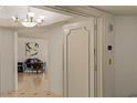 Bright entryway featuring tile floors, elegant chandelier, and a glimpse into the cozy living space at 2877 Paradise Rd # 2502, Las Vegas, NV 89109