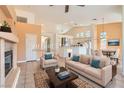 Inviting living room with neutral furniture, area rug, and a view to the kitchen at 2889 Anteres St, Las Vegas, NV 89117
