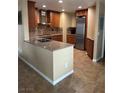 Updated kitchen featuring stone countertops and stainless steel appliances at 3150 Soft Breezes Dr # 1008, Las Vegas, NV 89128