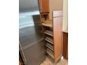 Close up on the kitchen pull out organizer next to the refrigerator at 3150 Soft Breezes Dr # 1008, Las Vegas, NV 89128