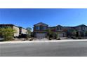 Street view of single Gathering homes with attached garages at 3339 Cromford Dr, North Las Vegas, NV 89081