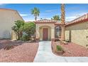 Inviting single-story home with a well-kept front yard with desert landscaping at 731 Rising Star Dr, Henderson, NV 89014