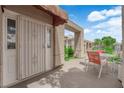 Private outdoor patio with a table and chairs, perfect for relaxing at 328 Wild Plum Ln, Las Vegas, NV 89107
