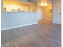 Bright living area with modern floors leading to an open kitchen at 8101 W Flamingo Rd # 2059, Las Vegas, NV 89147