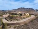 Spacious home with tile roof, desert landscaping, and a private driveway on an elevated lot at 1123 Christian Rd, Henderson, NV 89002