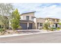 Modern home with desert landscaping, three car garage and stone accents at 12356 Notch Trail Ave, Las Vegas, NV 89138