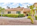 Tan home with orange tile roof, desert landscaping, and covered entryway at 2851 S Valley View Blvd # 1098, Las Vegas, NV 89102