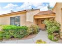 Front exterior featuring desert landscaping, walkway, and covered entry at 2851 S Valley View Blvd # 1098, Las Vegas, NV 89102