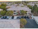 Beautiful multi-Gathering unit featuring ample parking, a well-maintained exterior, and private balconies at 900 Domnus Ln # 102, Las Vegas, NV 89144