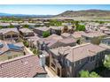 Areal view of a residential area showcasing a community with terracotta rooftops at 1024 Larkspur Point Ct, Las Vegas, NV 89138
