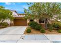 Charming home with a two-car garage, desert landscaping and a cozy front entrance at 1172 Via Della Costrella, Henderson, NV 89011