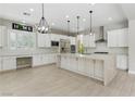 Bright, open kitchen featuring an oversized island, modern stainless appliances, and lots of counter space at 12119 Castilla Rain Ave, Las Vegas, NV 89138