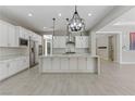 Bright, open kitchen featuring an oversized island, modern stainless appliances, and lots of counter space at 12119 Castilla Rain Ave, Las Vegas, NV 89138