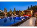 Inviting backyard pool area with comfortable seating and lush landscaping, perfect for relaxation and entertaining at 12119 Castilla Rain Ave, Las Vegas, NV 89138