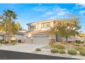Charming two-story home featuring a three-car garage and manicured front yard with mature landscaping at 2236 Timber Rose Dr, Las Vegas, NV 89134