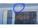 A close-up of the building exterior and address number highlighted in blue circle at 2525 Donna St # L, North Las Vegas, NV 89030