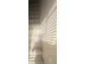A stairway inside a house with white walls and sunlight shining through blinds at 2525 Donna St # L, North Las Vegas, NV 89030