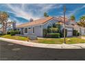 Beautiful single-Gathering home showcases a well-kept lawn and tidy landscaping at 3061 Waterside Cir, Las Vegas, NV 89117