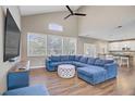 Bright living room featuring hardwood floors, large windows, and comfortable sectional sofa at 3420 Lockport St, Las Vegas, NV 89129