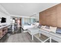 Modern open space featuring a comfortable sofa, sleeping area, and sleek design elements throughout at 4381 W Flamingo Rd # 1003, Las Vegas, NV 89103
