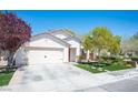 Charming single-story home with a well-manicured lawn and a two car garage at 5000 Charlo Dr, Las Vegas, NV 89131