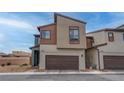 Contemporary two-story home featuring a two-car garage and modern architectural design at 6148 Juniper Grove St, Las Vegas, NV 89148