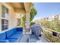 Balcony view showcasing outdoor seating, a barbecue grill, and neighborhood views at 6217 Lapilli Ave, Las Vegas, NV 89139