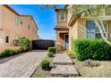Inviting entrance with a stone pathway and manicured shrubs at 6442 American Eagle Ave, Las Vegas, NV 89131