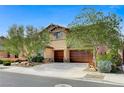 Attractive two-story house with lush landscaping and a spacious driveway at 6442 American Eagle Ave, Las Vegas, NV 89131