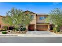 Charming two-story home with a well-manicured lawn and mature trees at 6442 American Eagle Ave, Las Vegas, NV 89131