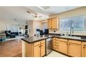 Bright kitchen with a breakfast bar that opens to the living area at 7705 Granberg Ct, Las Vegas, NV 89131
