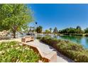Beautiful community lake with cascading waterfall, walking paths, lush greenery, and a serene atmosphere at 7824 Homing Pigeon St, North Las Vegas, NV 89084
