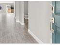 The entryway has a blue door, gray tile flooring, and a view of the hallway and bathroom at 851 Klamath Springs St, Henderson, NV 89011