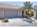Lovely single-story home featuring a tile roof, desert landscaping, and a convenient two-car garage at 8524 Little Fox St, Las Vegas, NV 89123
