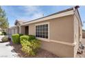 Charming home featuring desert landscaping, a tile roof, and a side window for added natural light at 8524 Little Fox St, Las Vegas, NV 89123