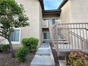 Condo stairway showcases modern design and well-maintained landscaping at 8985 S Durango Dr # 1033, Las Vegas, NV 89113