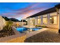 Beautiful backyard pool and spa area with a covered patio, perfect for entertaining at 921 Granger Farm Way, Las Vegas, NV 89145