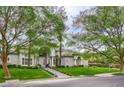Charming single-story home with lush landscaping, offering a welcoming entrance and picturesque setting for relaxation at 2338 Dolphin Ct, Henderson, NV 89074