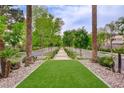 Picturesque street view lined with mature trees and lush landscaping, enhancing the neighborhood's appeal at 2338 Dolphin Ct, Henderson, NV 89074