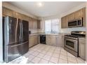 Well-lit kitchen featuring stainless steel appliances, granite countertops, and neutral-toned cabinetry at 4916 Mount Pleasant Ln, Las Vegas, NV 89113