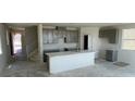 Bright, spacious kitchen with a large island and modern gray cabinetry, perfect for cooking at 9556 Hinson St, Las Vegas, NV 89139