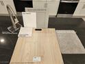 Kitchen finish samples: luxury vinyl plank, gray cabinets, white countertops, and stainless steel faucet at 9556 Hinson St, Las Vegas, NV 89139