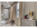 Inviting entryway features tiled floors, neutral walls, and an accent table at 10042 Bismuth St, Las Vegas, NV 89183