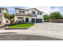Two story home with a three car garage, artificial lawn and inviting entryway at 1223 Starstone Ct, Henderson, NV 89014