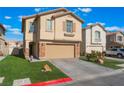 Charming two-story home with a well-manicured lawn, two-car garage, and landscaped yard at 1618 Meno Peak St, Las Vegas, NV 89115