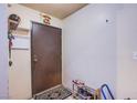An entryway featuring a brown door and basic decor, creating a simple, functional space at 2080 Karen Ave # 9, Las Vegas, NV 89169