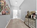 Elegant entryway boasting neutral walls, decorative art, a console table, and tile flooring at 253 Robledo St, Las Vegas, NV 89138